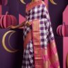 Model wearing Mahagauri purple and ivory checks pure silk Ilkal saree with pink Gali Dhadi border and Tope Pallu