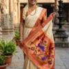 Mayura Bagh cream and rust Paithani — model pallu